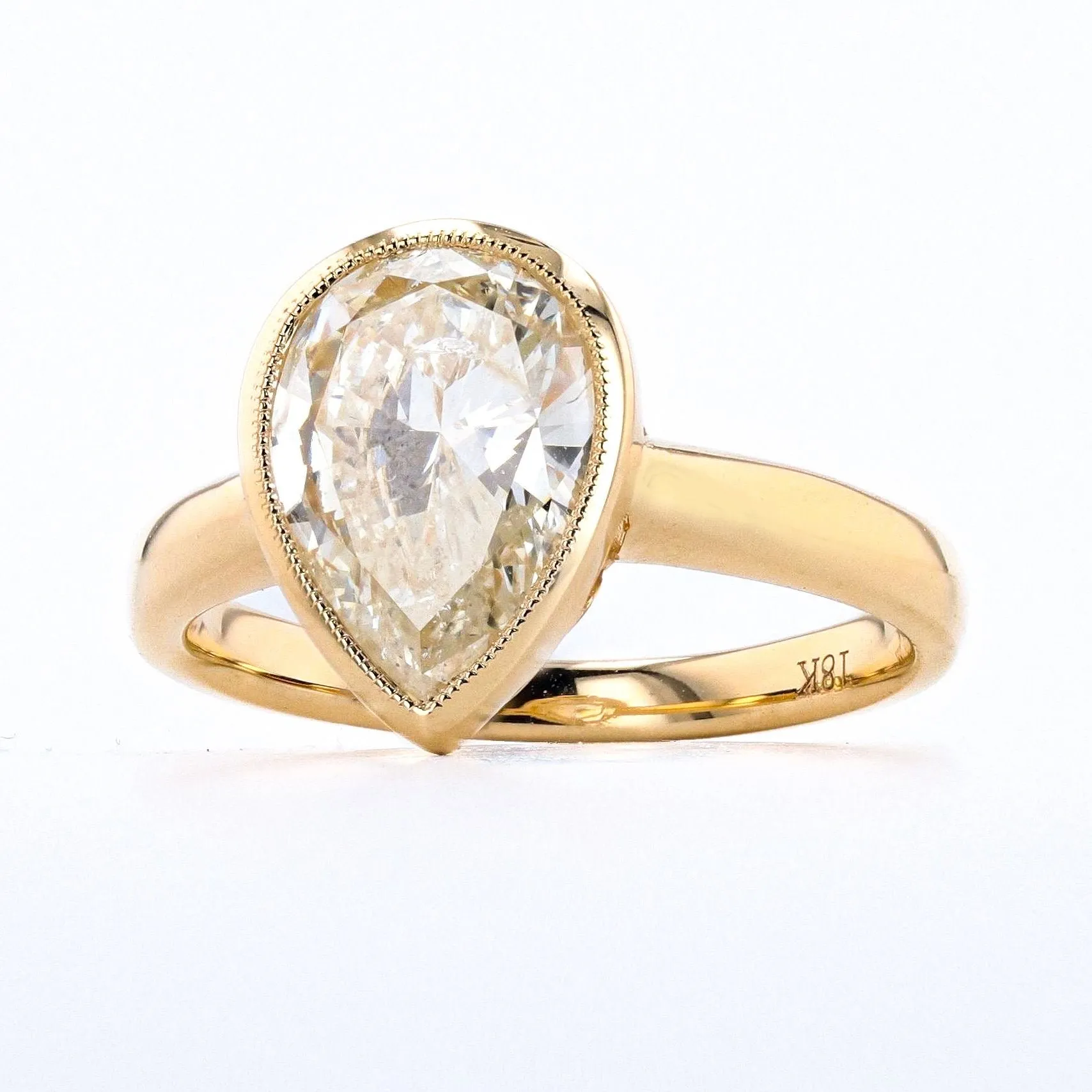 2.02 CARAT PEAR SHAPE DIAMOND BEZEL RING