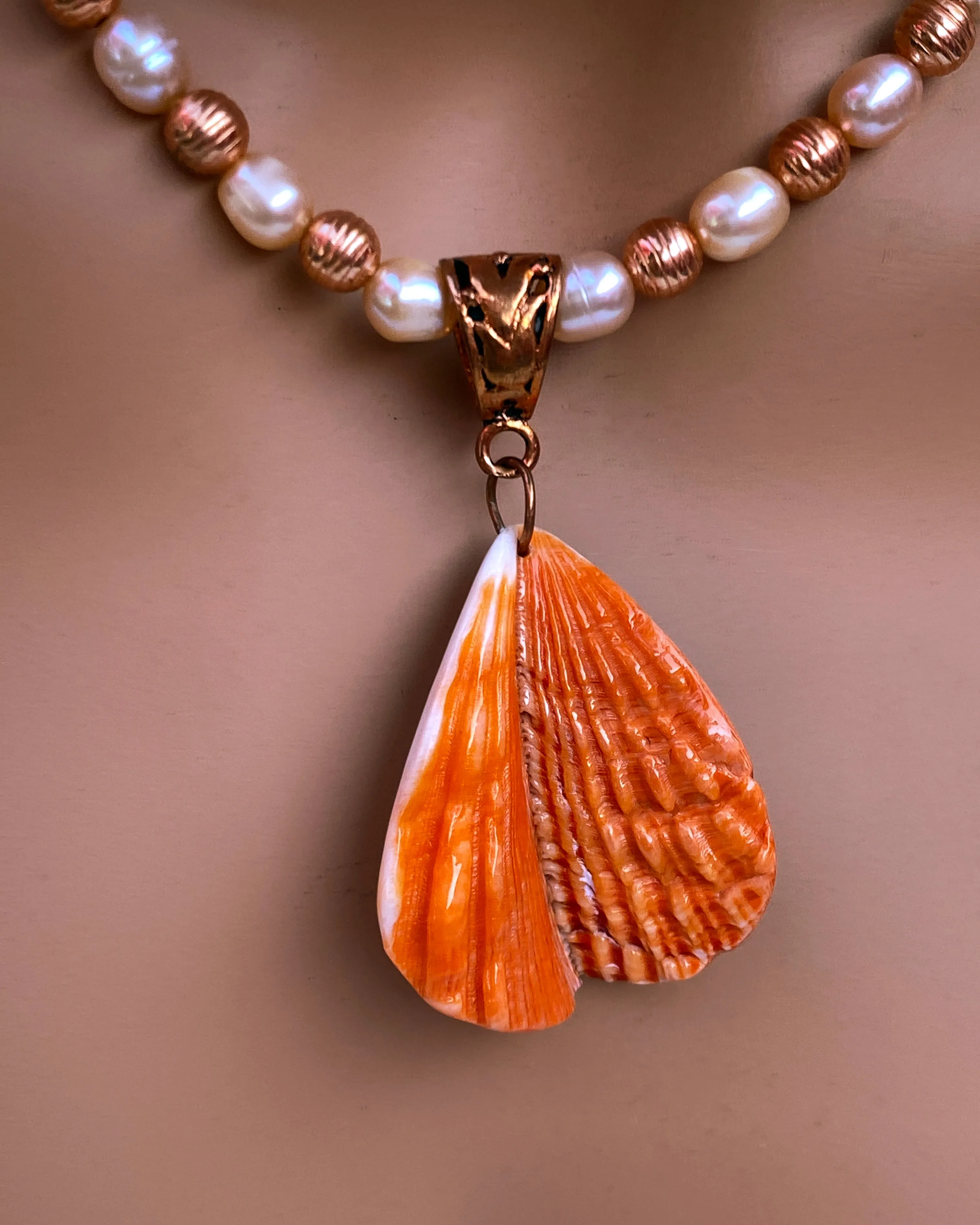 Shell Pendant on Pearl Necklace
